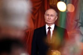 Vladimir Putin. He is pictured inside a Russian Orthodox Church