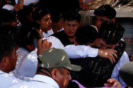 Friends and family members react during the funeral of mine worker Darwin Cobenas who along with fellow workers had been kidnapped by illegal miners last month and killed, in Piura, Peru