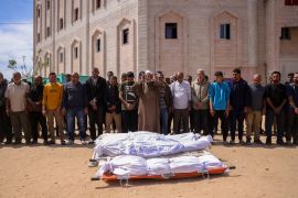 Mourners pray over the shrouded bodies of victims of Israeli strikes on Jabalia, at the Indonesian Hospital in Beit Lahiya, in the northern Gaza Strip [Bashar Taleb/AFP]