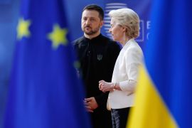 European Commission President Ursula von der Leyen, right, speaks with Ukraine's President Volodymyr Zelenskyy as they arrive for an EU Summit at the European Council building in Brussels, Belgium [File: Omar Havana/AP Photo]