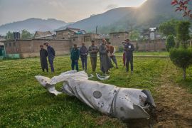 Debris of an aircraft lies in the compound of a mosque.