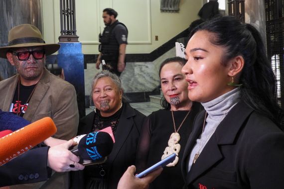 Hana-Rawhiti Maipi-Clarke, right, and her colleagues from Te Pati Maori talk to reporters.