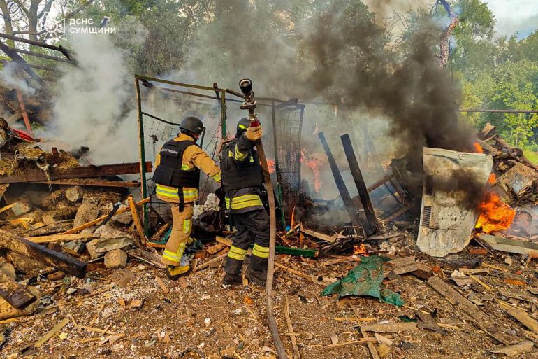 firefighters extinguish a fire following Russia's air raid in the village of Bilopillya in the Sumy region, Ukraine