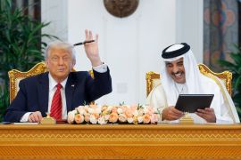 U.S. President Donald Trump and Qatar's Emir Tamim bin Hamad Al Thani meet in Doha, Qatar, May 14, 2025. REUTERS/Brian Snyder